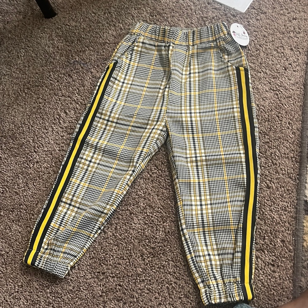 Plaid boy pants. Yellow white and black